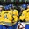 GRAND FORKS, NORTH DAKOTA - APRIL 18: Sweden's Lias Andersson #26, Erik Brannstom #14, Adam Thilander #8 and Elias Pettersson #21 celebrate after a third period goal against Switzerland during preliminary round action at the 2016 IIHF Ice Hockey U18 World Championship. (Photo by Minas Panagiotakis/HHOF-IIHF Images)

